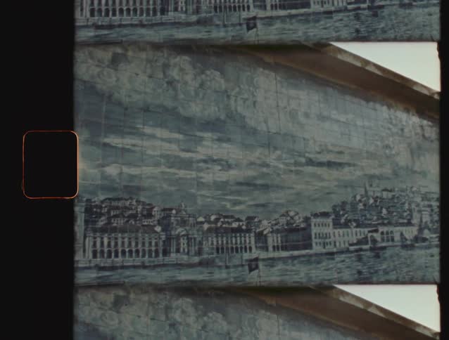 A vintage film aesthetic shot slowly pans across a classic Portuguese Azulejo tile mural depicting a waterfront city