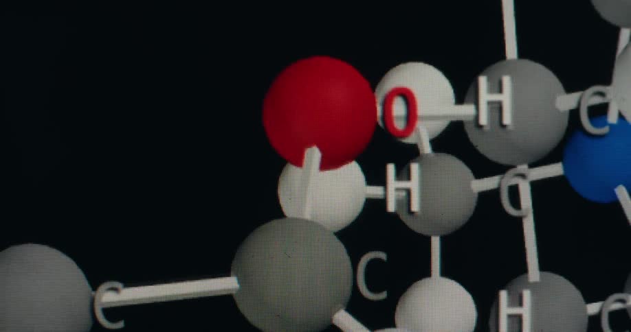 A detailed digital animation of a molecular structure with labeled atoms rotating against a black background
