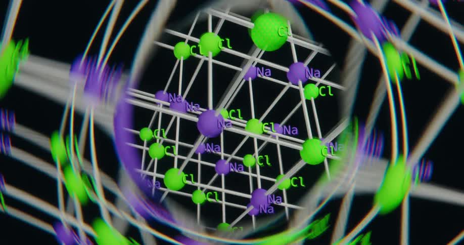 A scientific 3D animation showing the rotating molecular structure of Sodium Chloride (NaCl) in a crystal lattice