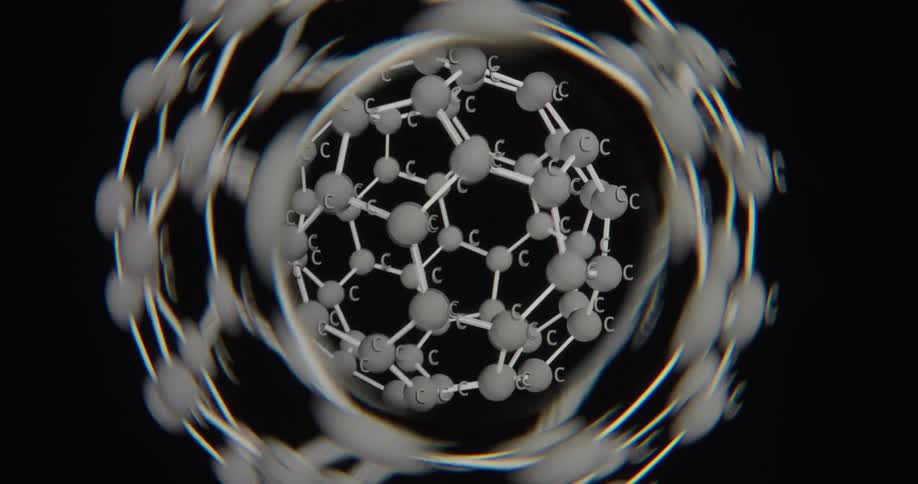 A 3D computer animation zooms into a spinning carbon fullerene buckyball molecule on a black background