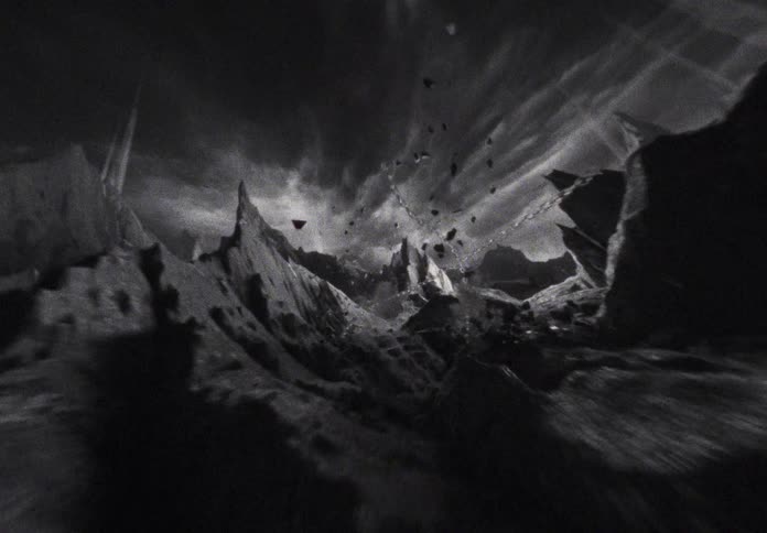 A first-person view of a chaotic, high-speed ride through a destructive, mountainous, black and white animated landscape