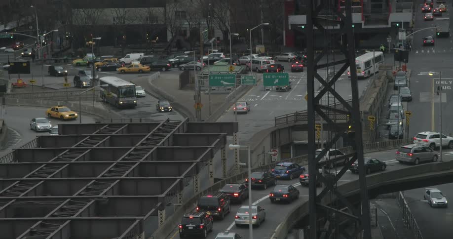 A large intersection with many cars moving around it