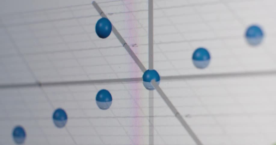 A macro shot shows a 3D data plot with blue spheres rotating on a digital screen, with a fast-moving clock overlay