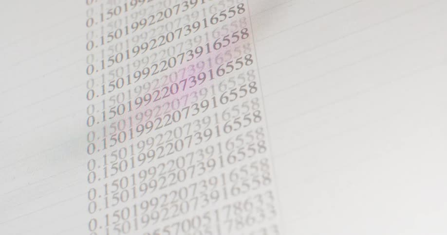 Close-up shot of a computer screen showing columns of numerical data scrolling down