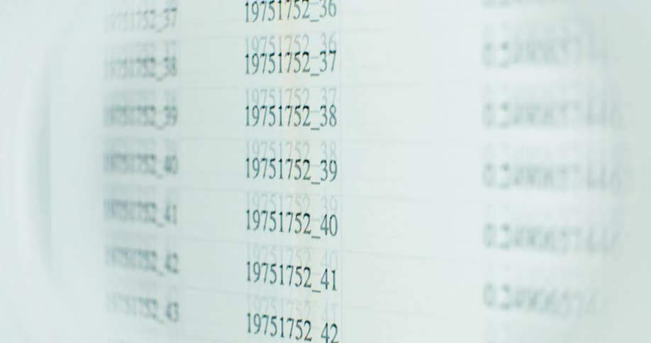 A close-up shot of a spreadsheet with rows of data scrolling down a computer screen
