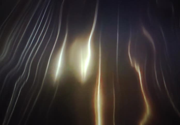 Elegant streams of glowing light shimmer and flow gracefully in this abstract animation