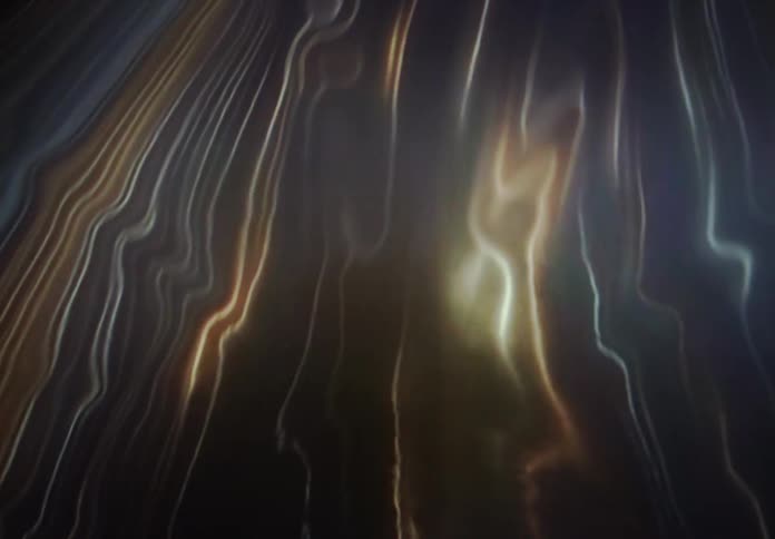 Hypnotic animation of glowing, fluid energy currents and shimmering light waves against a dark background