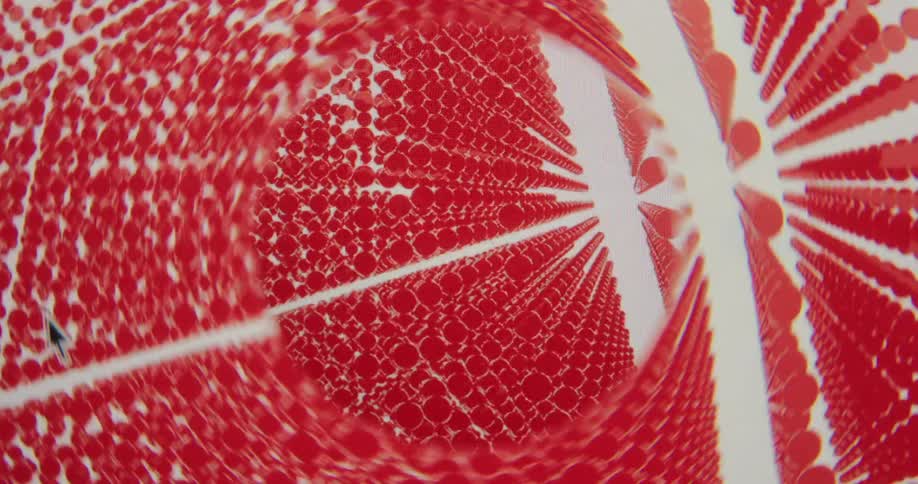 A screen recording of a hypnotic, rotating tunnel of red dots in an abstract graphic design
