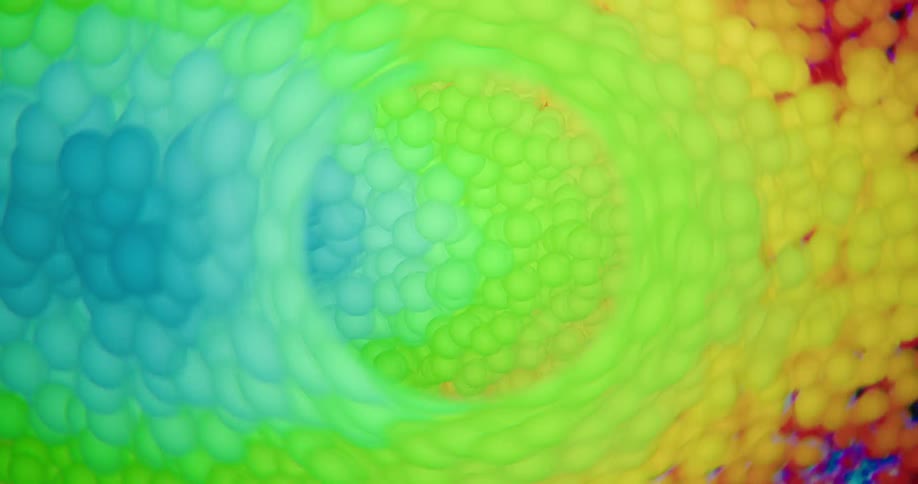 A swirling vortex of tiny, rainbow-colored spheres creates a dynamic and abstract background