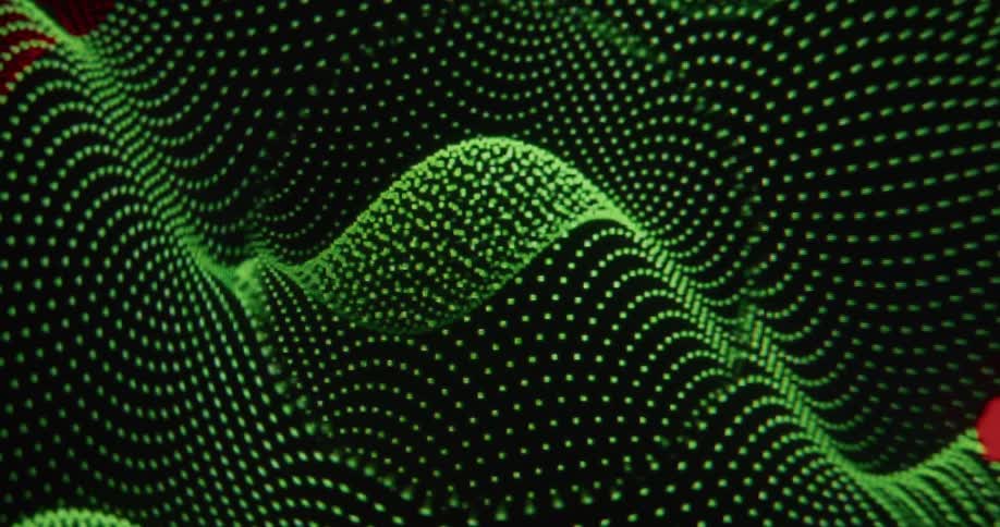 Close-up of a computer cursor navigating a landscape of green digital waves and plotting red data points on a screen