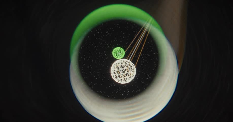 An abstract animation of geometric wireframe spheres and particles moving within a distorted digital lens