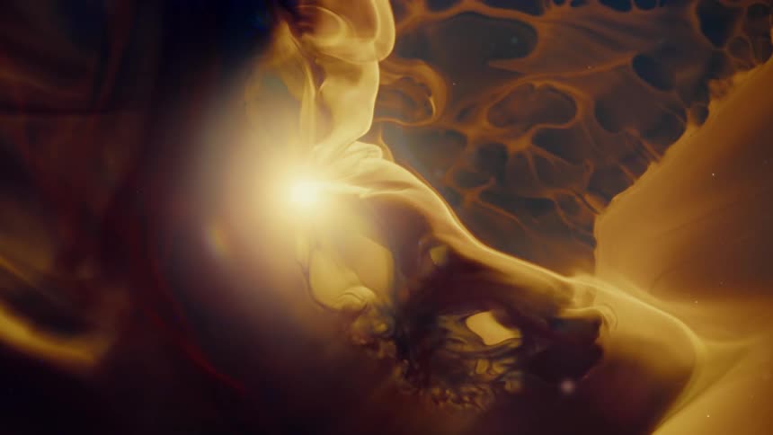 Ethereal golden clouds of gas and dust swirl around a glowing star in a deep space nebula
