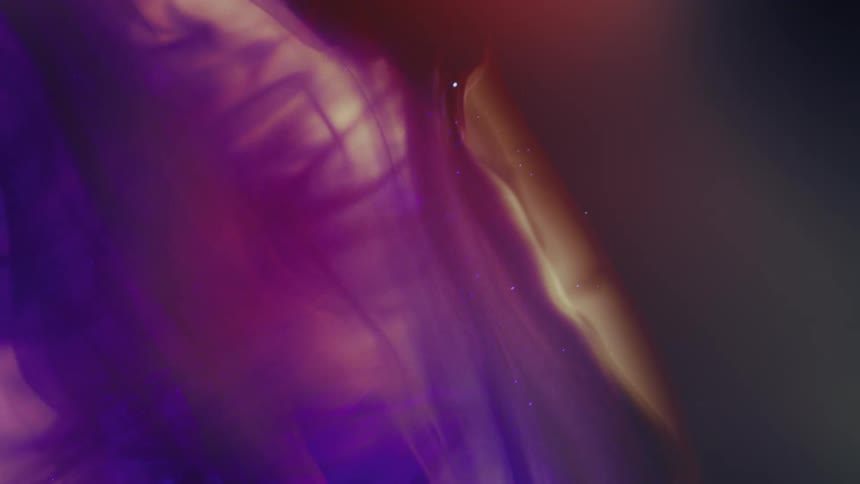 A slow motion macro shot of ethereal purple ink billowing and swirling in liquid, creating a vibrant, cosmic-like abstract background