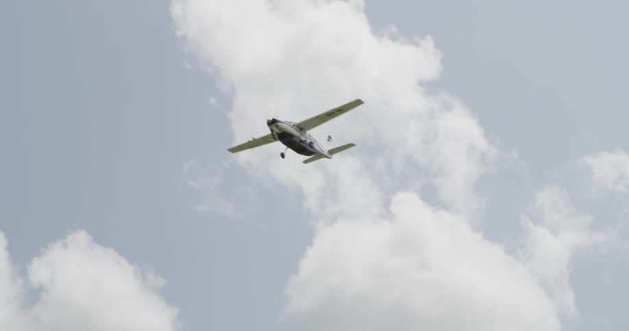 Airplane flying in the cloudy sky