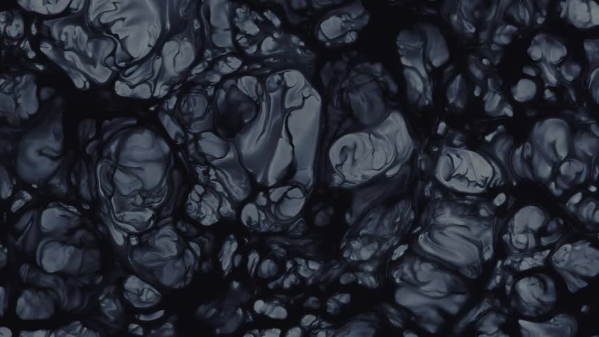 Slow-moving dark gray and black ink creates a mysterious and hypnotic liquid art background