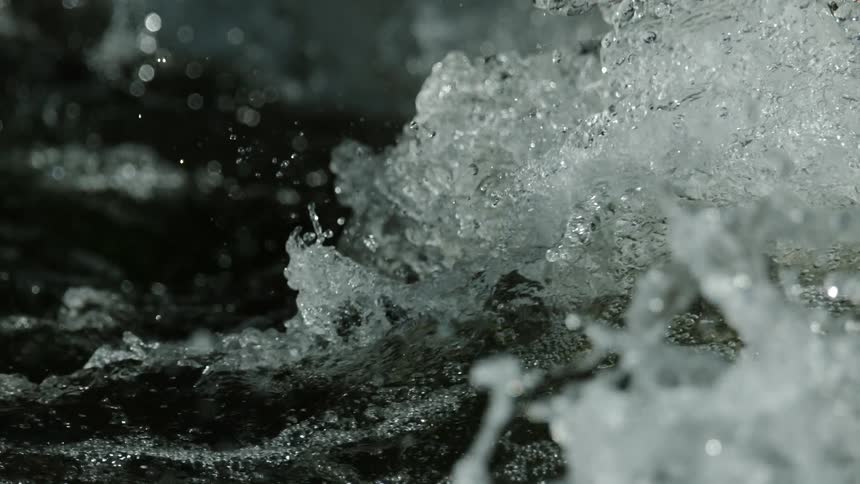 A powerful torrent of whitewater churns and splashes in extreme slow motion