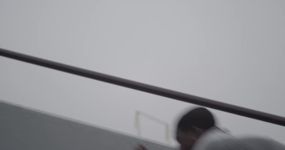 A man runs up stairs