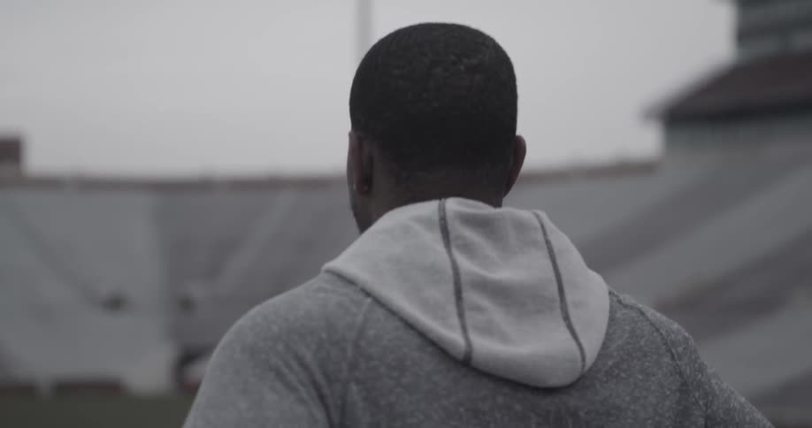 Man looks out at bleachers