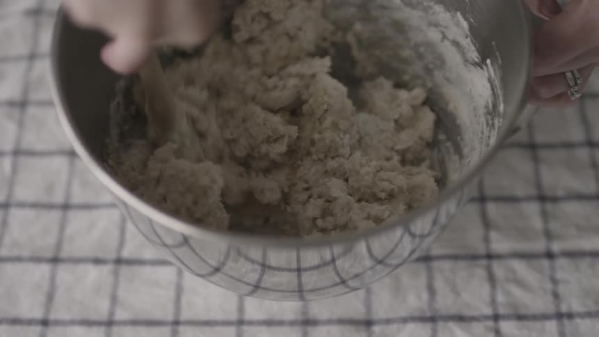 A bowl of batter is being mixed