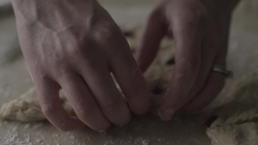 Woman shapes cookie dough