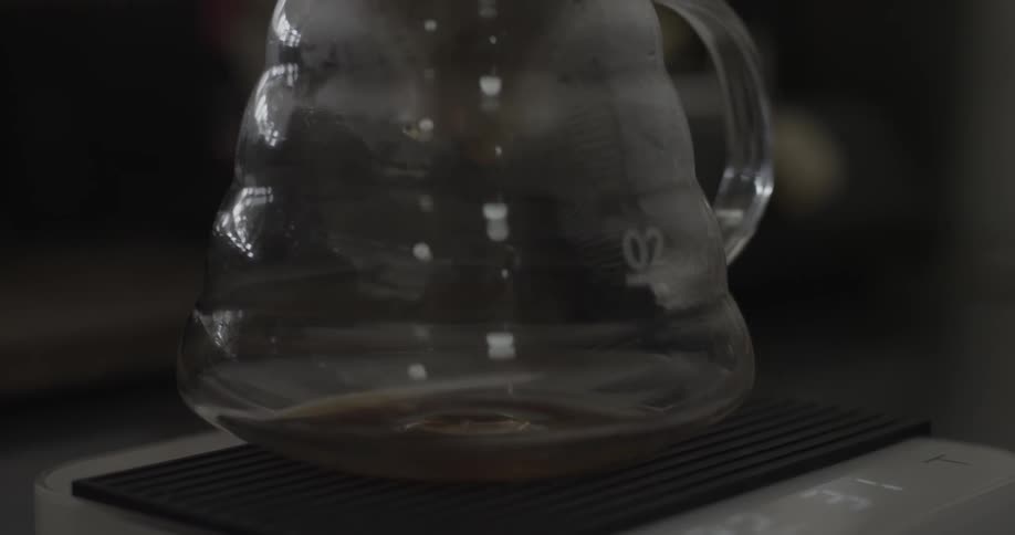 Coffee drips into a glass carafe