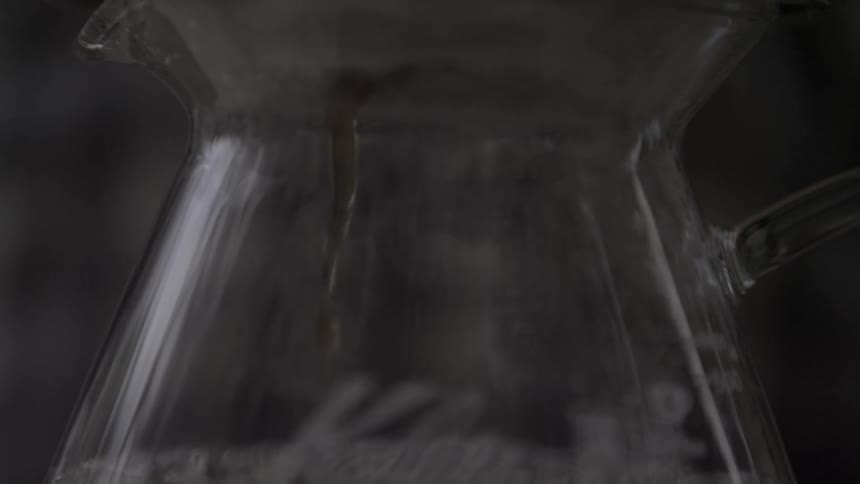 A coffee pitcher slowly drips coffee