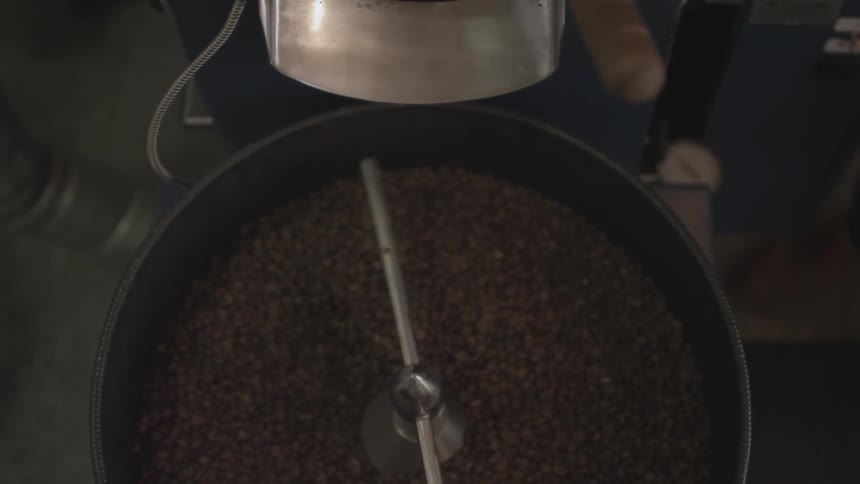 A machine spinning coffee beans