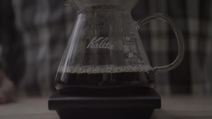 Coffee drips through a filter