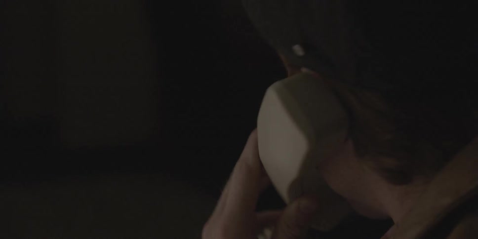A man is talking on the telephone