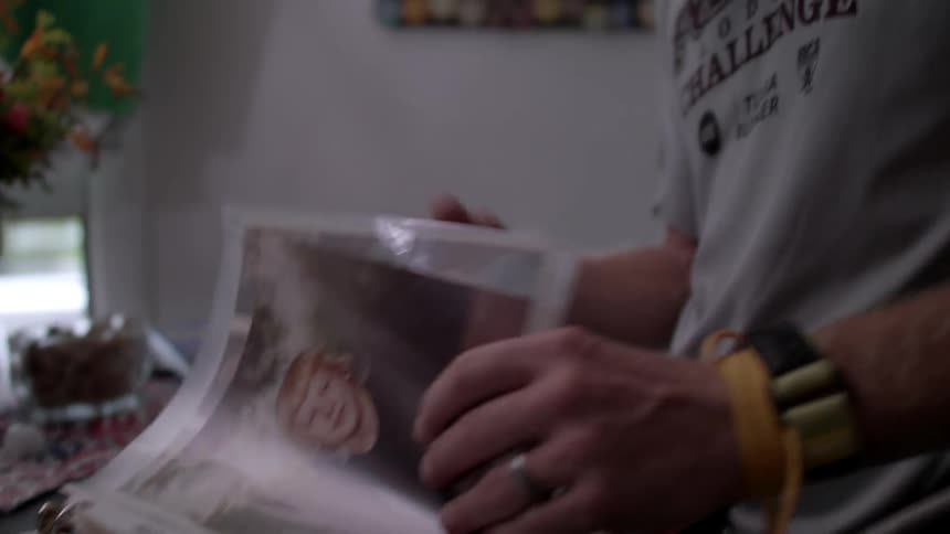 A man flips through a photo album