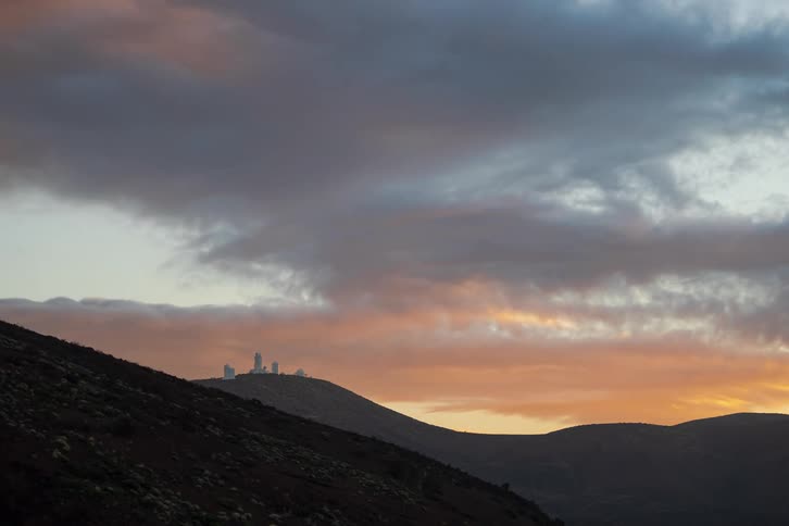 A time-lapse of dramatic clouds moving over the Roque de los Muchachos Observatory in La Palma during a beautiful sunset