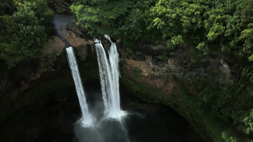 The stream leads to a cliff pouring a waterfall below
