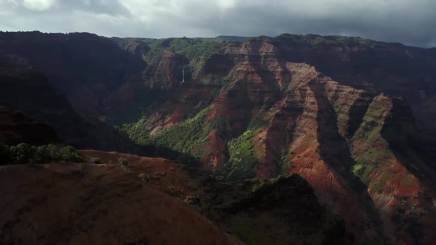 Clouds hover over waimea canyon