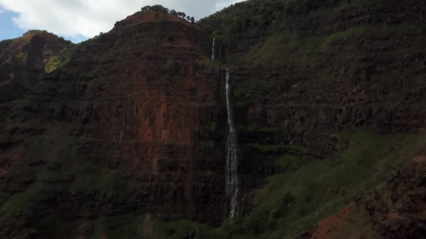 A thin waterfall on a mountain