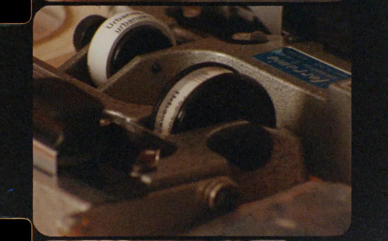Macro shots of a vintage film splicer and editing tape scanned from a Super 8mm film strip