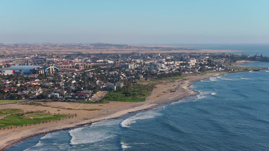Aerial view of the coastal city of Swakopmund in Namibia, where the vast desert landscape meets the Atlantic Ocean