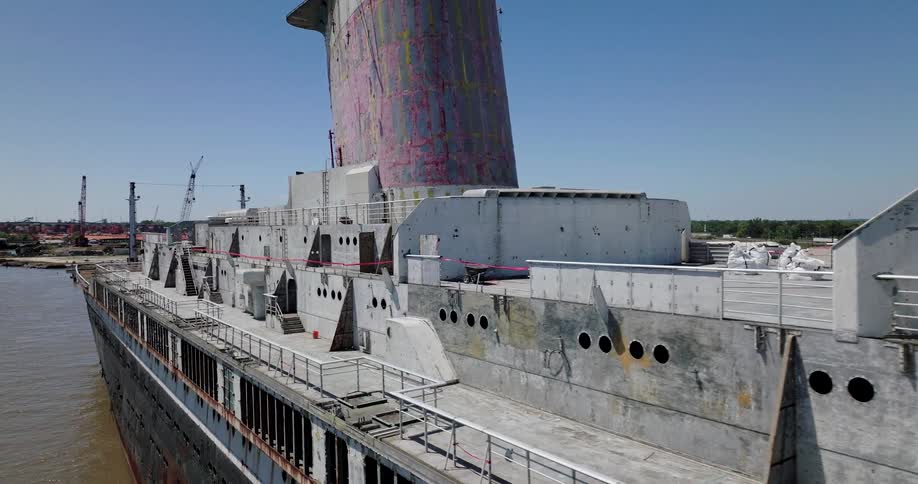 An aerial tour of the once-grand SS United States ocean liner, now abandoned and rusting in a desolate industrial port