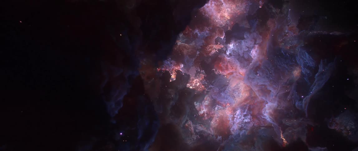 A mesmerizing and slow journey through a colorful, star-filled nebula in the vastness of deep space