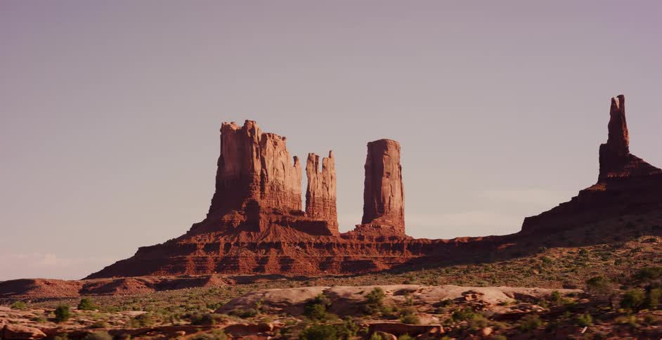 A scenic drive offers a stunning view of the iconic red rock formations in Monument Valley, Utah