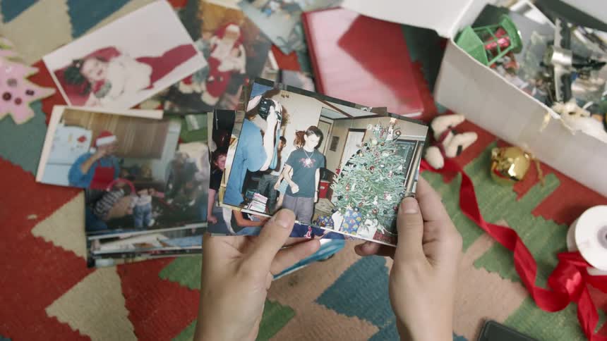 Person sorts through old photographs
