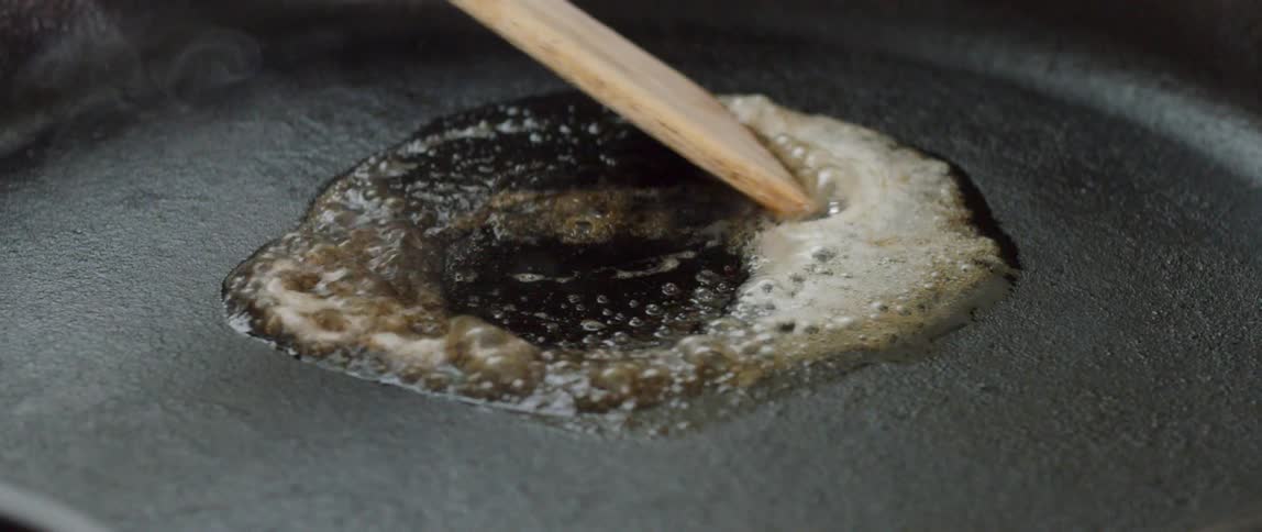Butter melts in a skillet