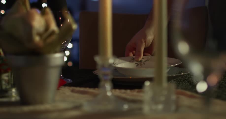 A person sets an elaborate table