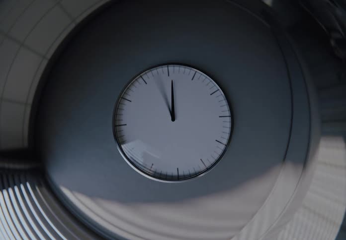 Modern wall clock speeds through the hours in a time-lapse as daylight transitions to night