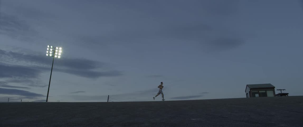 A man runs at dusk