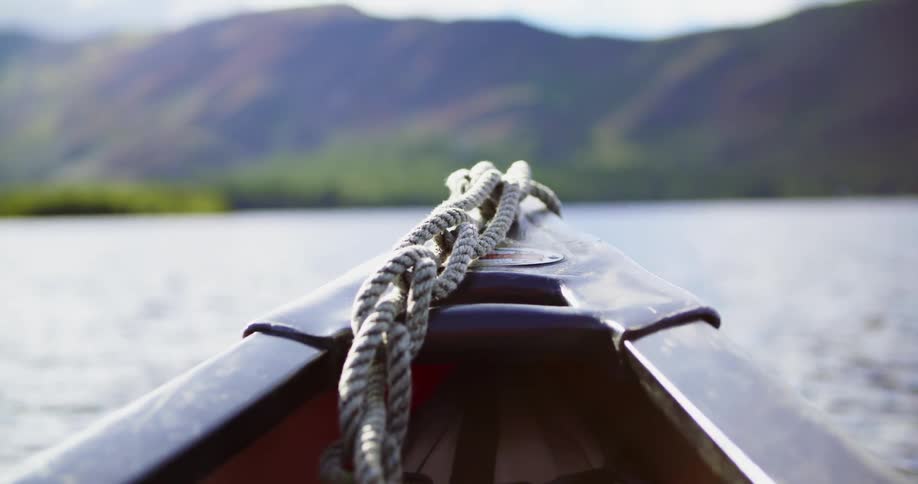 A boat floats on a mountain lake