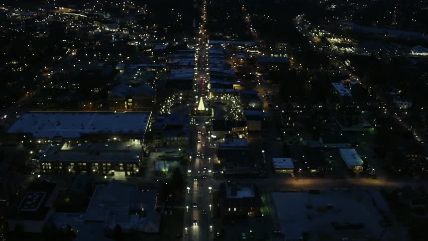 City lights shine below at night
