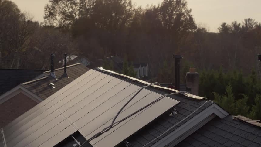 Wires hang over the solar panels on this roof
