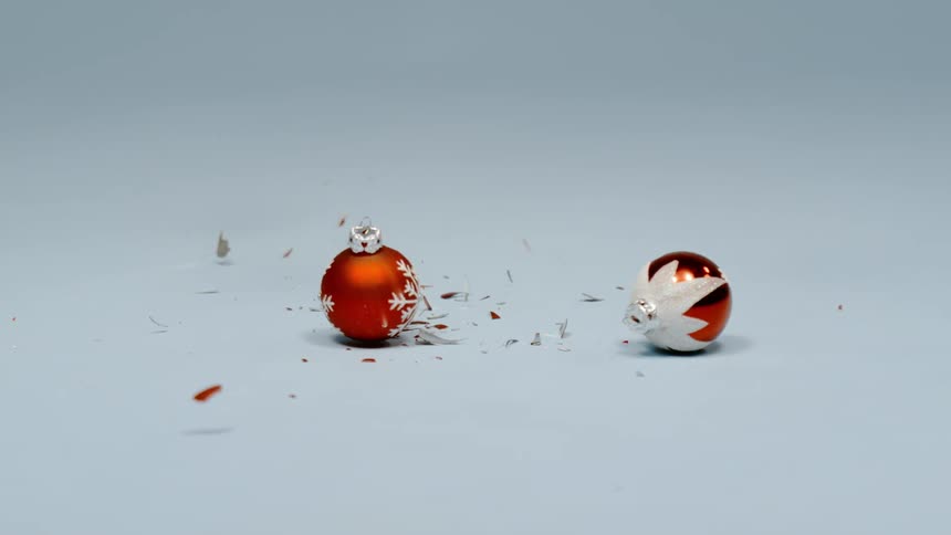 Christmas ornaments shatter and bounce as they fall to the ground