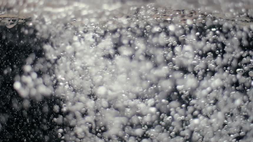 Bubbles flow and swirl in a liquid