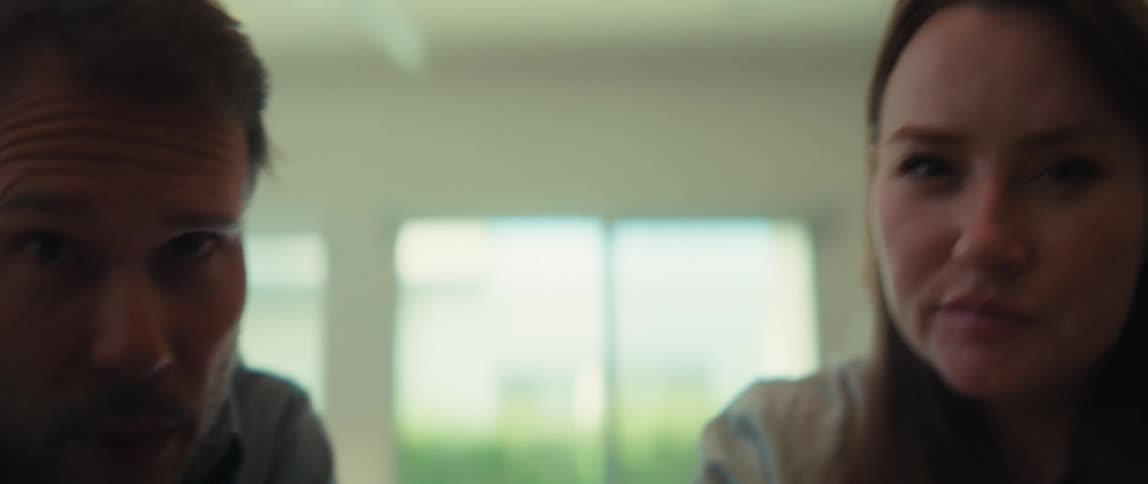 A low-angle point of view of a man and woman having an intimate and engaging conversation